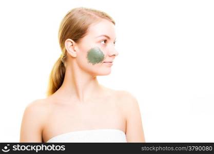 Skin care. Woman with clay mud mask on face isolated. Girl taking care of dry complexion. Beauty treatment.