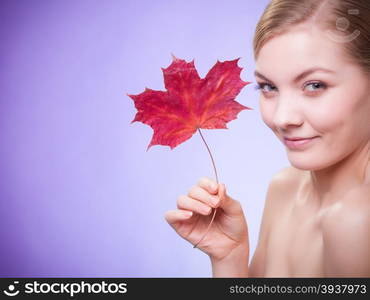 Skincare habits. Portrait of young woman with leaf as symbol of red capillary skin on violet. Face of girl taking care of her dry complexion. Studio shot.