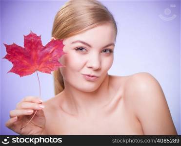 Skincare habits. Portrait of young woman with leaf as symbol of red capillary skin on violet. Face of girl taking care of her dry complexion. Studio shot.