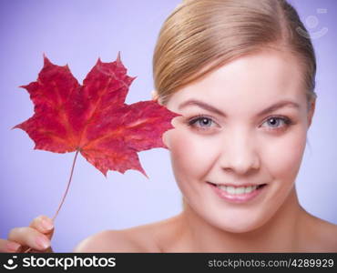 Skincare habits. Portrait of young woman with leaf as symbol of red capillary skin on violet. Face of girl taking care of her dry complexion. Studio shot.