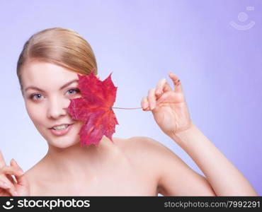 Skincare habits. Portrait of young woman with leaf as symbol of red capillary skin on violet. Face of girl taking care of her dry complexion. Studio shot.