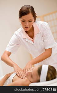 Skincare - woman cleavage massage at salon in day spa