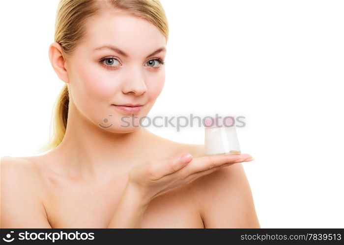 Skincare. Young woman girl taking care of her dry complexion applying moisturizing cream isolated. Beauty treatment.
