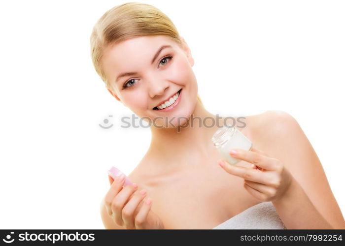 Skincare. Young woman girl taking care of her dry complexion applying moisturizing cream isolated. Beauty treatment.