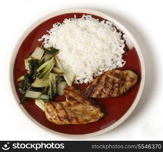 Skinless chicken breasts marinaded in soy sauce and olive oil, served with sauteed bok choi asian cabbage and white Thai jasmine rice.