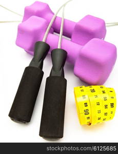Skipping rope, measuring tape and and Pink dumbbells in a neoprene cover