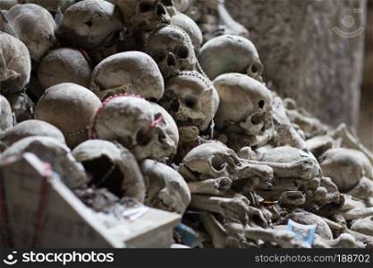 Skull and bones in ancient ossuary, Naples