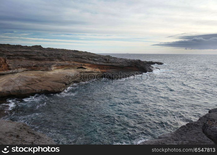 sky above rocks and stony coast. Sea landscape. Sea landscape