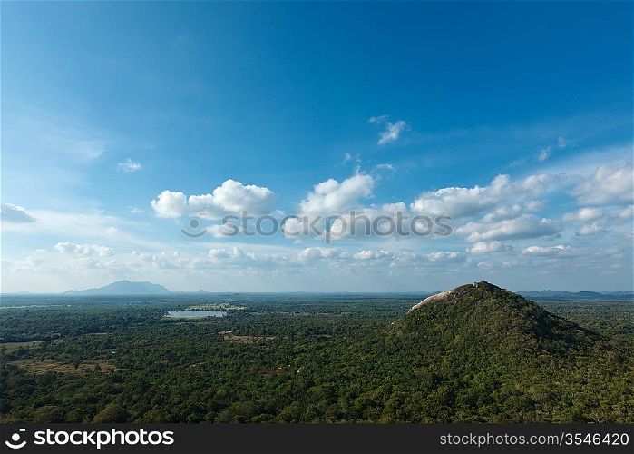 Sky above small mountains, covered with trees. Sri Lanka