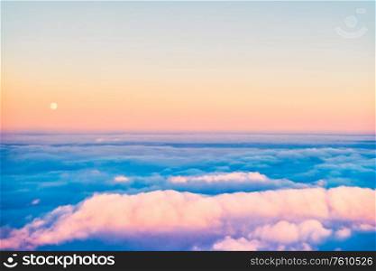 Sky and clouds at sunset, aerial view from plane
