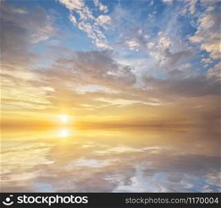 Sky background and water reflection on sunset. Nature composition.