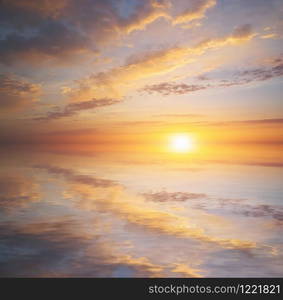 Sky background and water reflection on sunset. Nature composition.