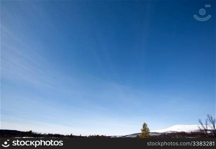 Sky Background, Designers tool - A clear blue sky with slight wisps of clouds