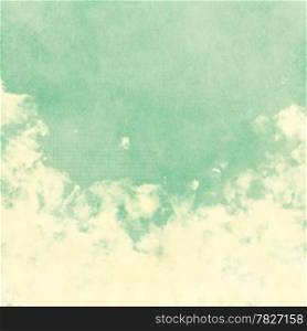 Sky, fog, and clouds on a textured, vintage paper background with grunge stains
