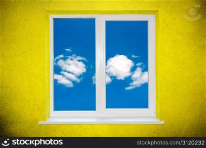 Sky in the window on green painted wall