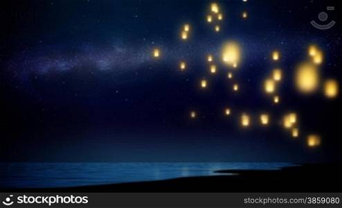 Sky lanterns flying over sea