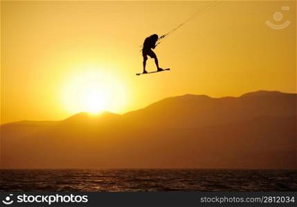 Sky-surfing in the rays of the setting sun on lake Kinneret