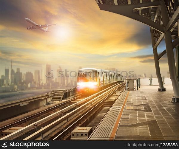 sky trains and mass transportation station with modern building in city background