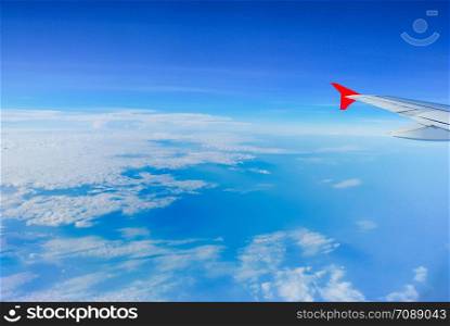 Sky view from airplane. Aerial view from windows. Transportation Concept.