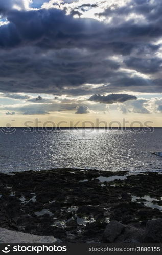 Sky with clouds before a rainstorm over the black sea at Giardini-Naxos, Sicily, Italy