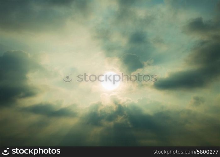 Sky with cumulus clouds and a bright sun