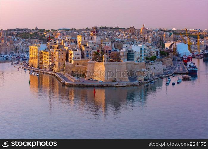 Skyline aerial view of ancient Fort Saint Michael of Senglea peninsula and the Grand Harbor as seen from Valletta at sunrise, Malta.. Grand harbor and Senglea from Valletta, Malta