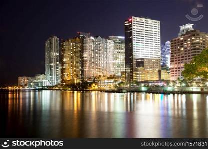 Skyline of apartment buildings at Brickell district in Miami at night, Florida, USA