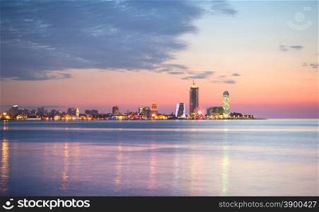 Skyline of Batumi at sunset with reflection in the sea. Georgia