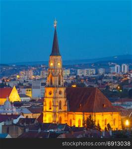 Skyline of Cluj-Napoca with the church of Saint Michael at twilight. Romania