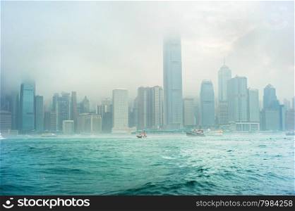 Skyline of Hong Kong in the fog during the rain