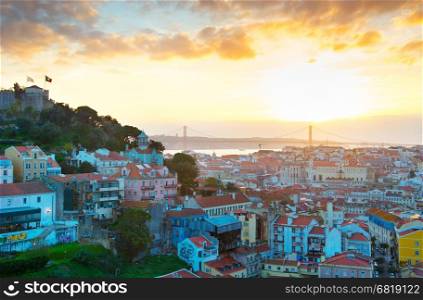 Skyline of Lisbon at sunset with sun in the sky. Portugal