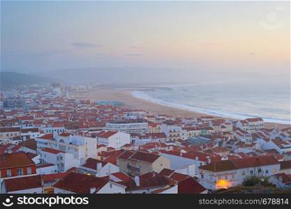 Skyline of Nazare - famous seashore Portuguese town at dusk. Portugal
