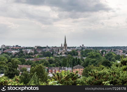Skyline of Norwich in East England on a cloudy day, with both cathedrals and the castle to be recognised.