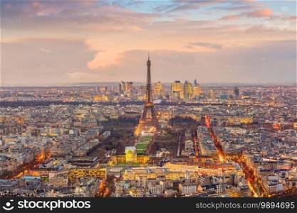 Skyline of Paris with Eiffel Tower at sunset in France from top view