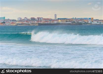 Skyline of Peniche - coastal town in Portugal. Atlantic ocean in the foreground