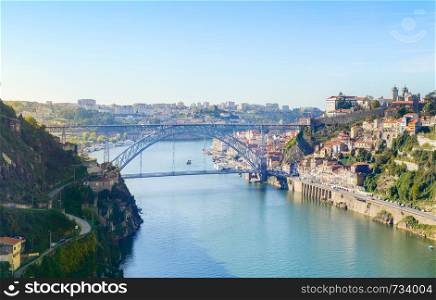 Skyline of Porto downtown on Douro river banks with famous Dom Luis I Bridge, Portugal