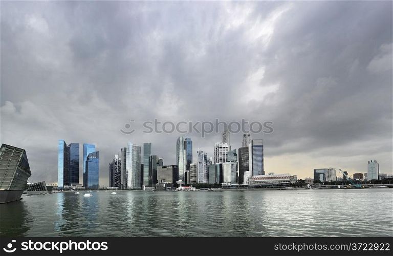 Skyline of Singapore with a dark stormy sky