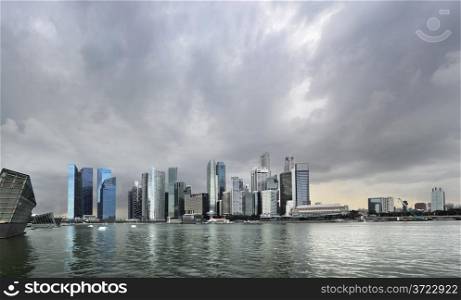 Skyline of Singapore with a dark stormy sky