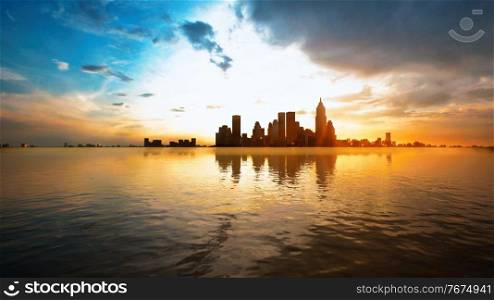 Skyline with skyscrapers and sea at sunset