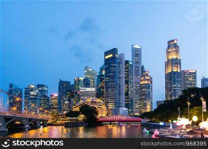 Skyscraper and skyline in Singapore city night. Cityscape and businedd building in night.