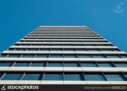 Skyscraper photographed from below against pure blue sky