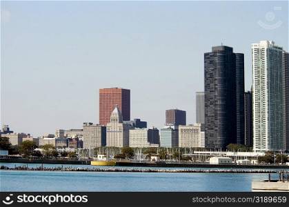 Skyscrapers along a lake, Lake Michigan, Chicago, Illinois, USA