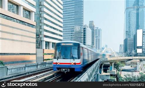 skytrain mass transit with cityscape.