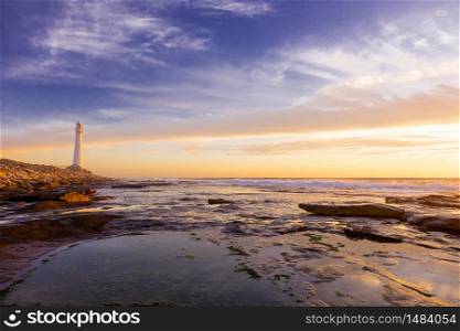 Slangkop Lighthouse near the town of Kommetjie in Cape Town, South Africa at Sunset