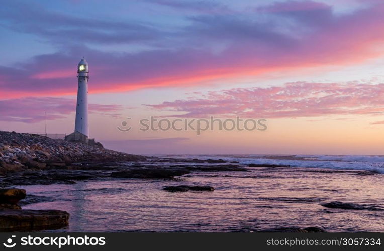 Slangkop Lighthouse near the town of Kommetjie in Cape Town, South Africa at Sunset