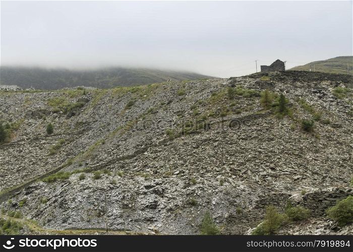 Slate slag heaps in cloudy conditions, Bleneau Ffestiniog, Gwynedd, Wales, United Kingdom.