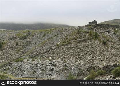 Slate slag heaps in cloudy conditions, Bleneau Ffestiniog, Gwynedd, Wales, United Kingdom.