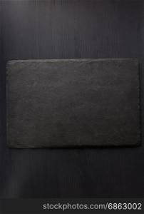 slate stone at wooden background texture