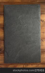 slate stone at wooden background texture surface