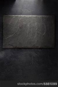 slate stone signboard at black background texture